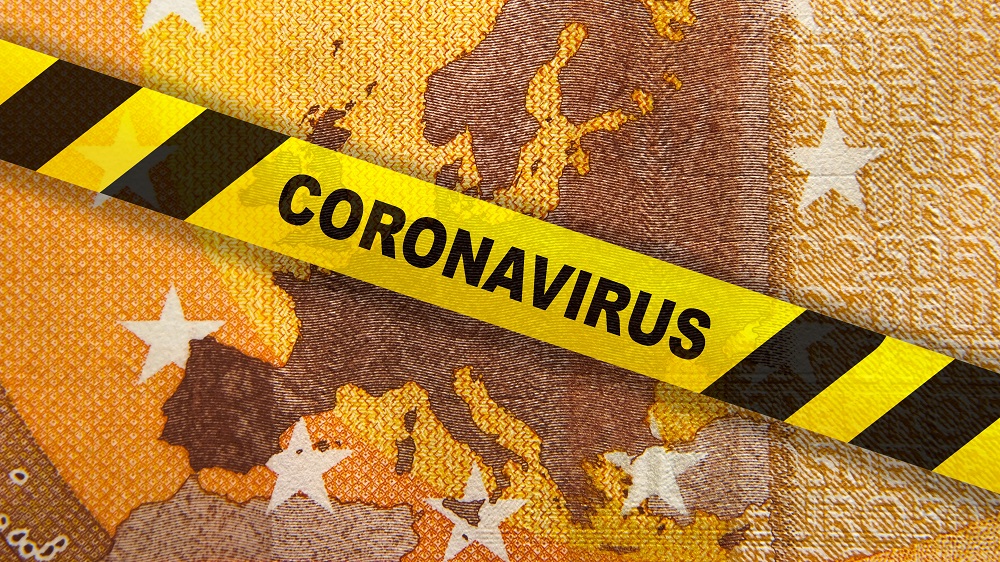 An image of a textured background resembling a banknote with a yellow caution tape overlay. The tape prominently displays the word "CORONAVIRUS," symbolizing the impact of the pandemic on economic themes.